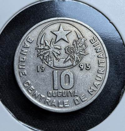 外国优质老铜币纪念币银币专场，周六晚上九点倒数截拍，满百包邮，节前出差在外，5月3日统一发货,可寄存半年，喜欢朋友微信扫描二维码可直接参拍 毛里塔尼亚10乌吉亚，币面饰有星月、麦穗与棕榈图案，象征伊斯兰信仰与农牧经济，是该国独立后巩固主权、发展民族货币体系的见证。