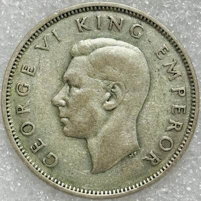 文馨钱币收藏第 302 场，国外回流老铜币，中东阿拉伯地区，拉美等国货币，30 号 1 号二连拍，长期接代拍业务，预计 4 月 4-5 号发货 1941 年英属新西兰乔治六世 1 佛罗琳银币，11.3 克 500 银