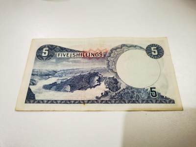 零零发流通品外国纸币拍卖 无佣金 乌干达早期5先令很有特色的手掌水印，边有个裂