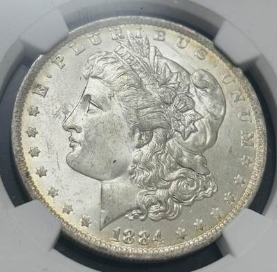 文馨钱币收藏第 303 场，【五一钱币荟，收藏盛宴】长期接代拍业务 NGC MS64  1884 年美国摩根鹰洋银元 O 版，淡淡金黄环边，金彩包浆，细节看图