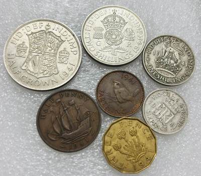 文馨钱币收藏第 302 场，国外回流老铜币，中东阿拉伯地区，拉美等国货币，30 号 1 号二连拍，长期接代拍业务，预计 4 月 4-5 号发货 英国 1941 年乔治六世 1 法新---半克朗大银币一组 7 枚，包含 4 枚银币，共 33.87 克银，均 500 银，其中 2 先令，半克朗目测 UNC 品，总体都是极美品，喜欢的出价