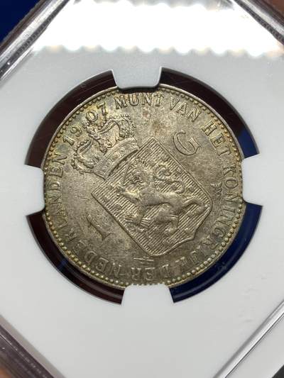 《竞宝斋》第484场 周日，周一，周二 3场连拍 （全场包邮）20级店铺 欢迎送拍 NGC AUD 荷兰1907年威廉敏娜少女头一盾银币，包浆很不错，尤其背面带五彩包浆，个人感觉严评了