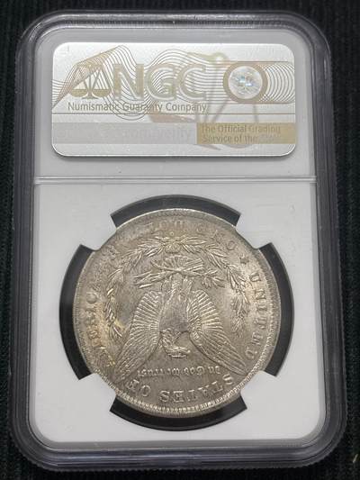 文馨钱币收藏第 303 场，【五一钱币荟，收藏盛宴】长期接代拍业务 NGC MS64  1884 年美国摩根鹰洋银元 O 版，淡淡金黄环边，金彩包浆，细节看图