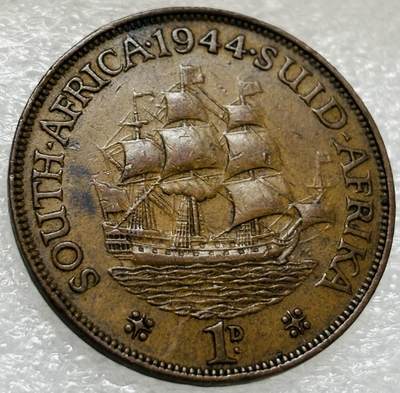 文馨钱币收藏第 302 场，国外回流老铜币，中东阿拉伯地区，拉美等国货币，30 号 1 号二连拍，长期接代拍业务，预计 4 月 4-5 号发货 极美品 1944 年英属南非乔治六世 1 便士铜币