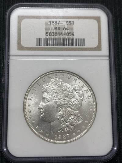 文馨钱币收藏第 303 场，【五一钱币荟，收藏盛宴】长期接代拍业务 NGC MS64  1887 年美国摩根鹰洋银元，老盒严评，转光炸裂，细节看图