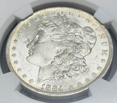 文馨钱币收藏第 303 场，【五一钱币荟，收藏盛宴】长期接代拍业务 NGC MS64  1884 年美国摩根鹰洋银元 O 版，淡淡金黄环边，金彩包浆，细节看图