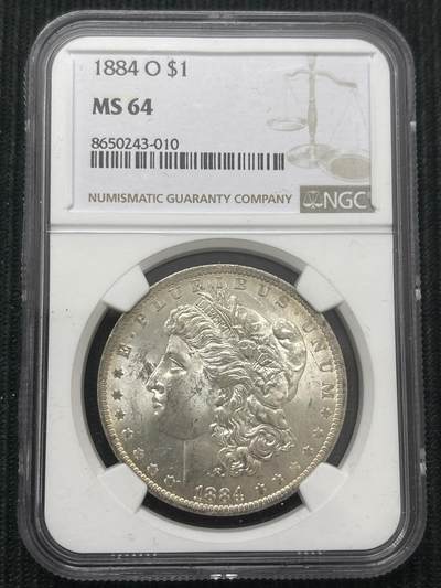 文馨钱币收藏第 303 场，【五一钱币荟，收藏盛宴】长期接代拍业务 NGC MS64  1884 年美国摩根鹰洋银元 O 版，淡淡金黄环边，金彩包浆，细节看图