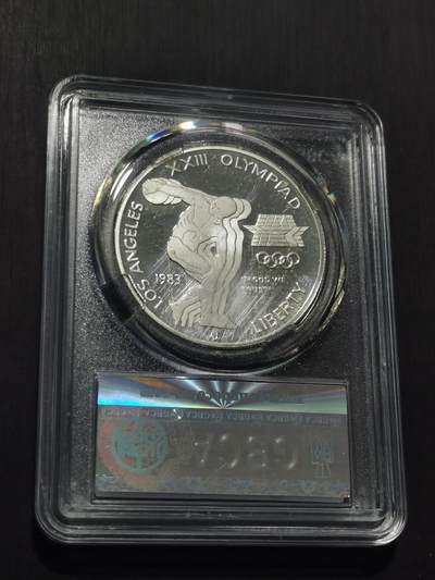 天下钱庄专场欢迎参拍 精制美国洛杉矶奥运会一美元银币，盒子有点花