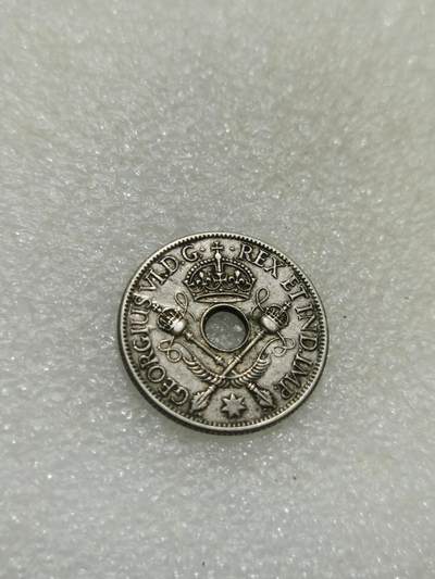 天下钱庄专场欢迎参拍 - 新几内亚中孔银币